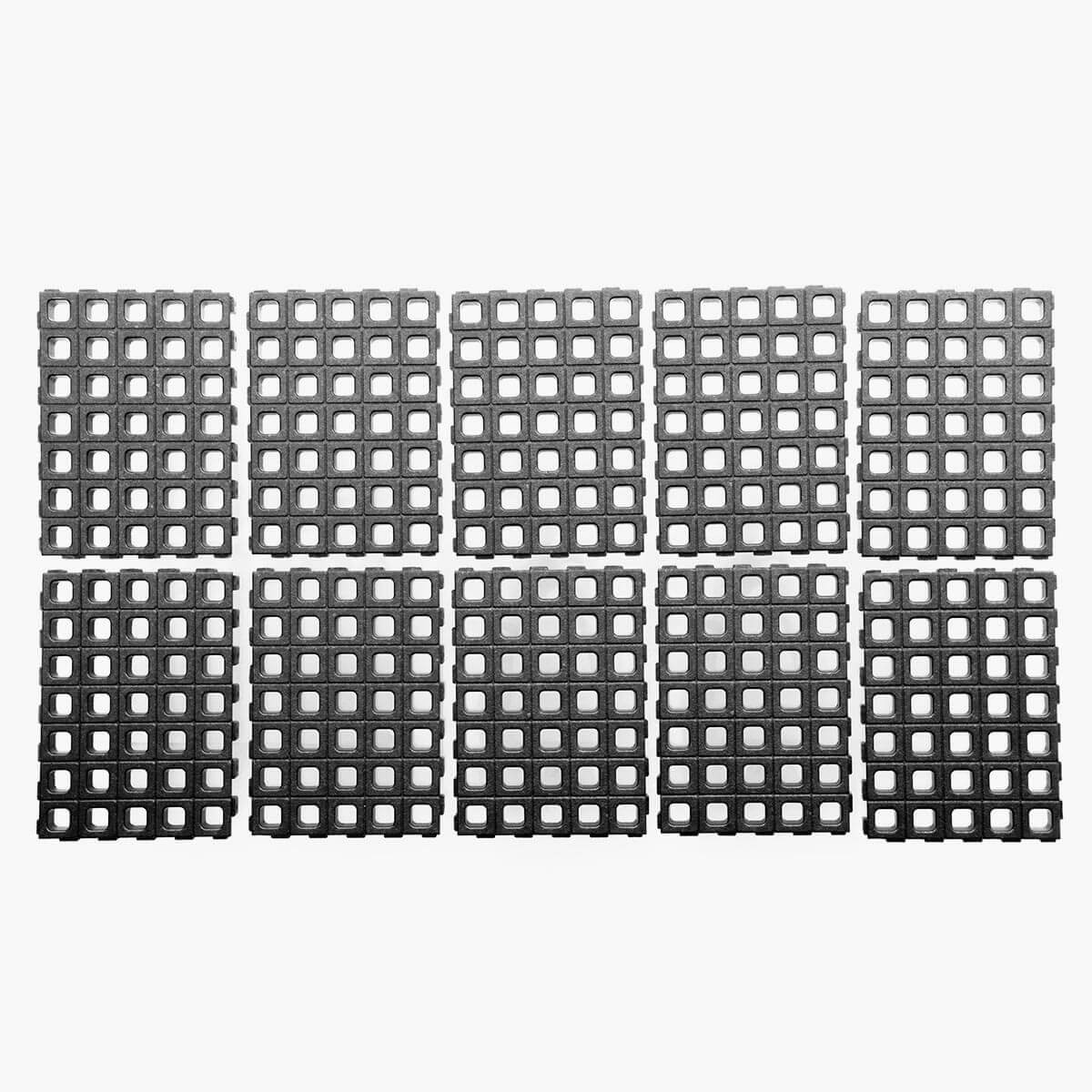 Studio layout of ten black modular EPP foam base panels from the Magpul DAKA Universal GRID Organizer Long Rifle kit.
